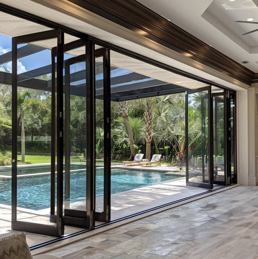 Black Rhino aluminum folding bi-fold door system opening to pool area for seamless indoor-outdoor living